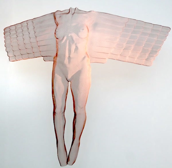 A sculpture of a copper-coloured angel floating