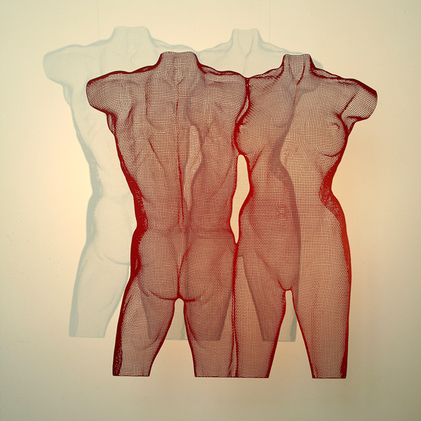 Red steel sculpture of two nude torsos VENII by artist David Begbie