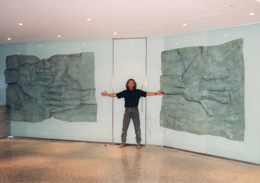 Very large wall-pieces as a composition for an office lobby, depicting hands