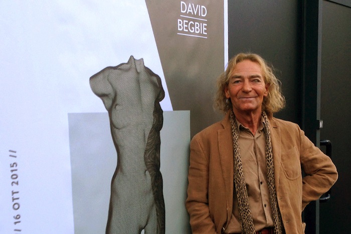 Sculptor David Begbie and poster for his exhibition