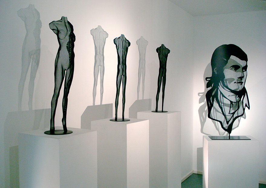 3 body portrait sculptures and a poet portrait sculptures seen at an art exhibition