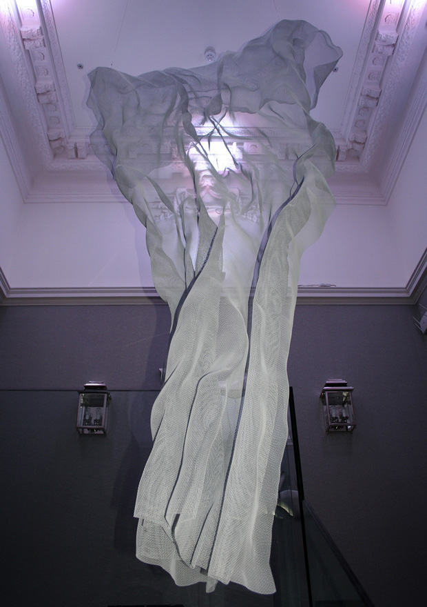 A cloud shaped modern sculpture adores a hotel corridor