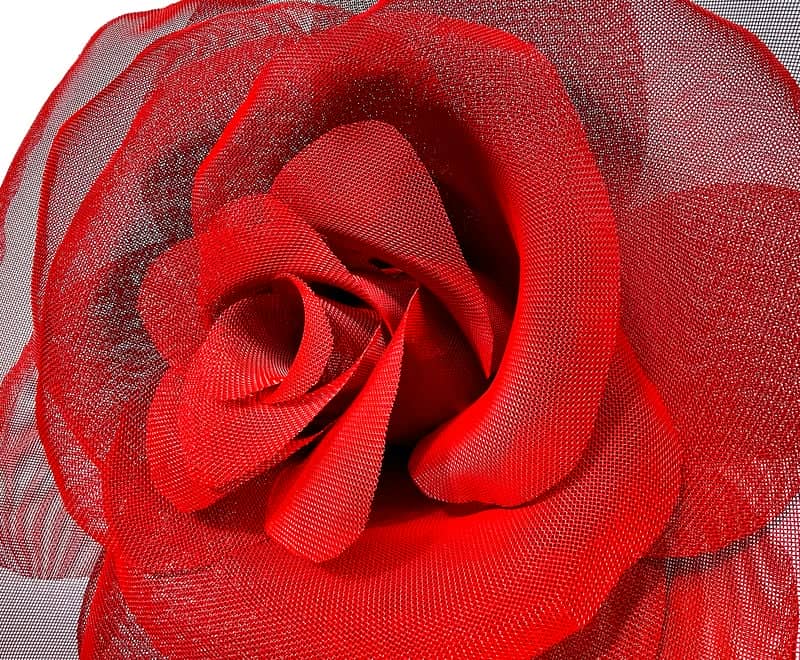 A red rose sculpture made from stainless steel wire