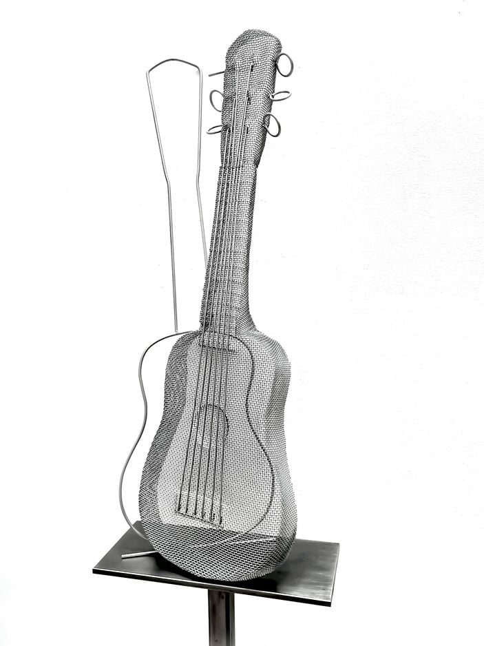 A guitar made from steel and steelmesh. Artwork 2024 by sculptor David Begbie