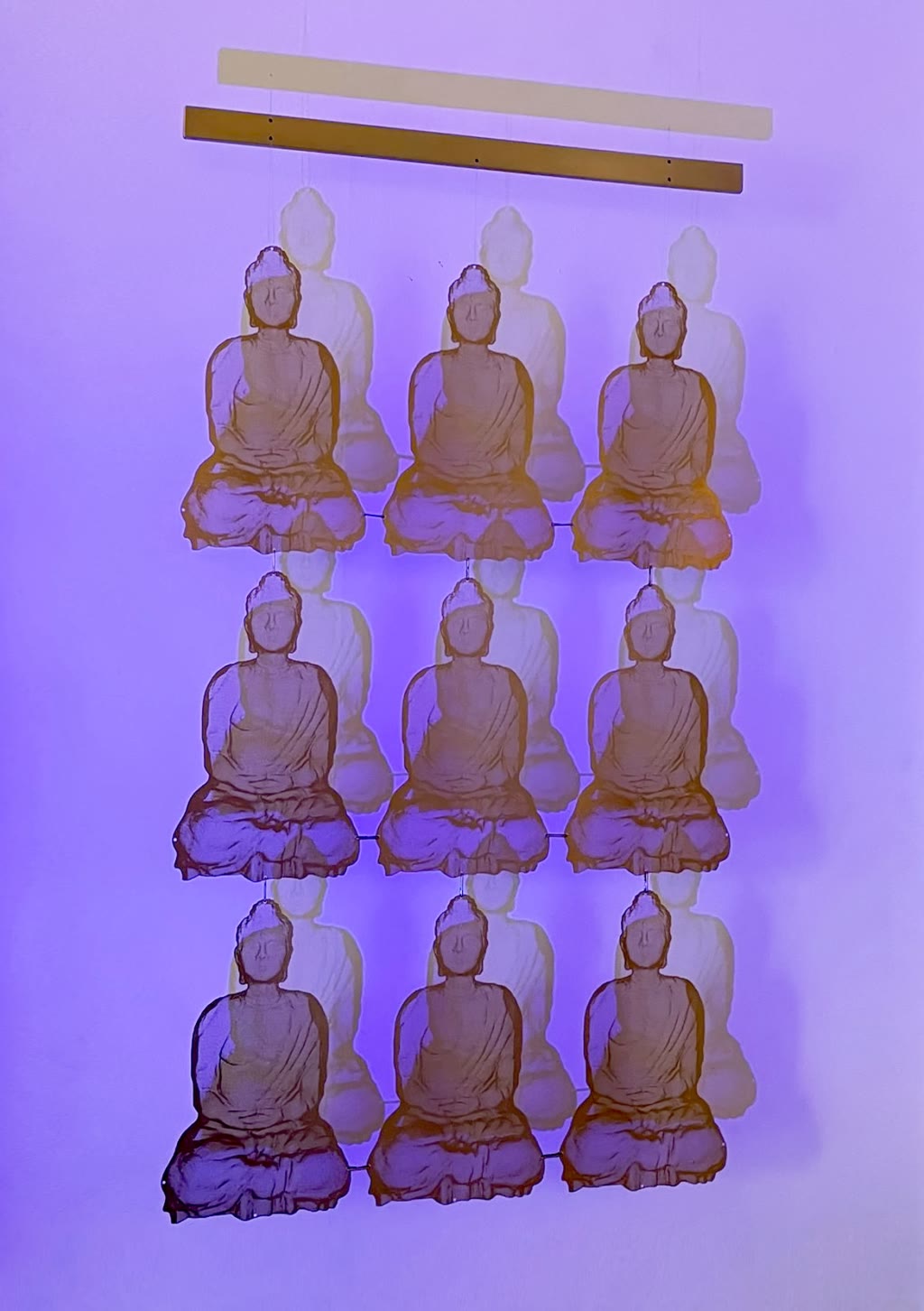 Buddha David Begbie wall sculpture ELEMENTS purple light